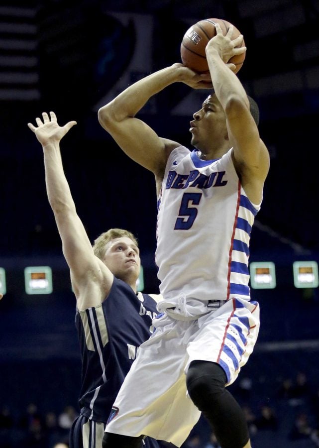 DePaul guard Billy Garrett Jr., right, shoots against George Washington guard Paul Jorgensen during the second half of an NCAA college basketball game on Tuesday, Dec. 22, 2015, in Rosemont, Ill. DePaul won 82-61. (AP Photo/Nam Y. Huh)