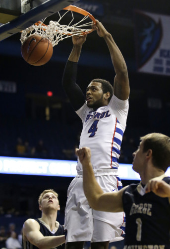 DePaul forward Myke Henry (4) dunks against George Washington during the second half of an NCAA college basketball game on Tuesday, Dec. 22, 2015, in Rosemont, Ill. DePaul won 82-61. (AP Photo/Nam Y. Huh)