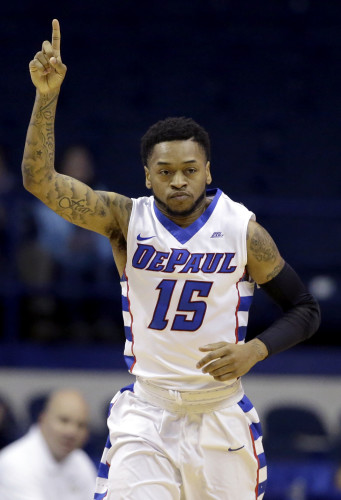 DePaul guard Aaron Simpson points after scoring a basket during the first half of an NCAA college basketball game against George Washington on Tuesday, Dec. 22, 2015, in Rosemont, Ill. DePaul won 82-61. (AP Photo/Nam Y. Huh)