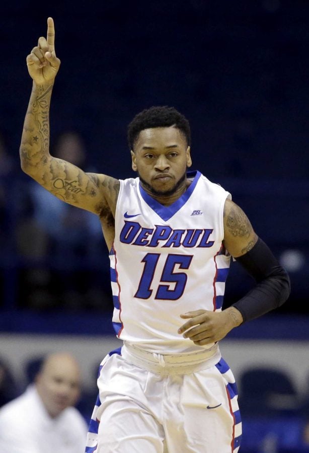 DePaul guard Aaron Simpson points after scoring a basket during the first half of an NCAA college basketball game against George Washington on Tuesday, Dec. 22, 2015, in Rosemont, Ill. DePaul won 82-61. (AP Photo/Nam Y. Huh)