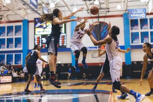 DePaul guard Jessica January (14) passes it to forward Mart'e Grays (35) while being defended by UConn forward Breanna Stewart. DePaul lost 86-70 Wednesday against No. 1 UConn. (Josh Leff | The DePaulia) 