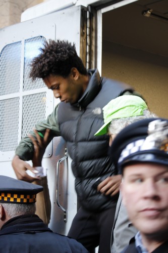 16-year-old Lamon Reccord is released after being briefly detained by police during a protest Wednesday. (Kirsten Onsgard / The DePaulia)