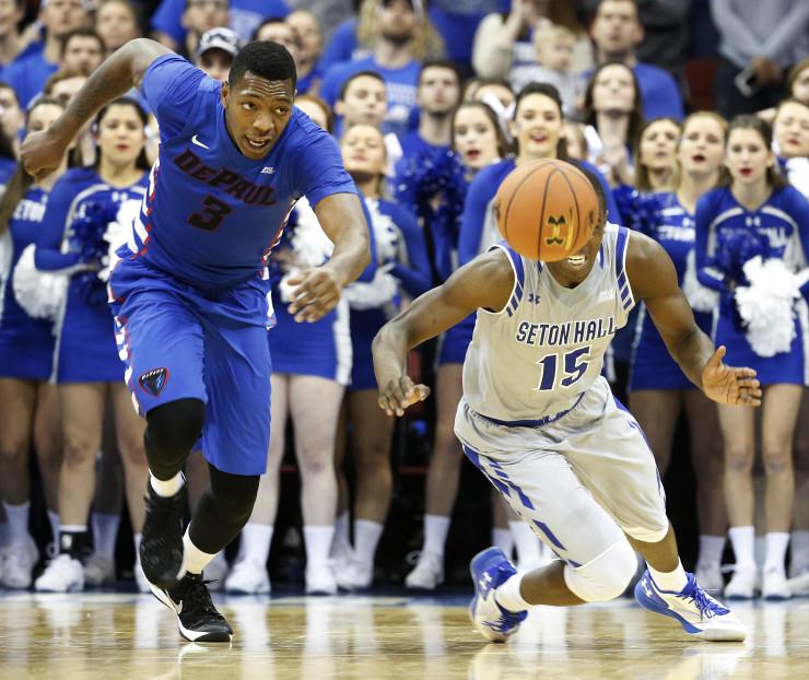 DePaul forward Rashaun Stimage (3) and Seton Hall guard Isaiah Whitehead (15) chase after a loose ball during the second half of an NCAA college basketball game, Saturday, Jan. 2, 2016, in Newark, N.J. Seton Hall won 78-74. (AP Photo/Julio Cortez)