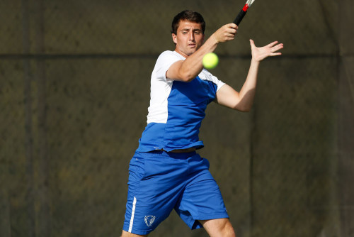 Senior Kyle Johnson returns a ball. Johnson is one of three seniors. (Photo courtesy of STEVE WOLTMANN / DEPAUL ATHLETICS)