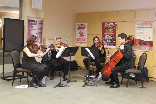 A string quartet consisting of DePaul students Emily McClean, Danielle Simandl, Dana Debofsky and Joshua Dema played themes from the “Harry Potter” series for attendees of DAB’S DePaul After Dark event. (Maddy Crozier / The DePaulia)
