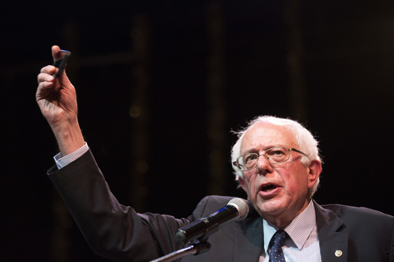 Vermont Sen. and Democratic presidential candidate Bernie Sanders holds up his cell phone as he speaks about citizens' ability to record police-officer involved violence at the Village Leadership Academy during a campaign stop in Chicago on Wednesday, Dec. 23, 2015. (Erin Hooley/Chicago Tribune/TNS)