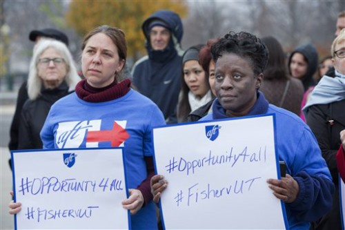 Members of the American Federation of Teachers rally in support of affirmative action outside of the Supreme Court in Washington, Wednesday, Dec. 9, 2015, as the court hears oral arguments in the Fisher v. University of Texas at Austin affirmative action case. (AP Photo/Jacquelyn Martin)
