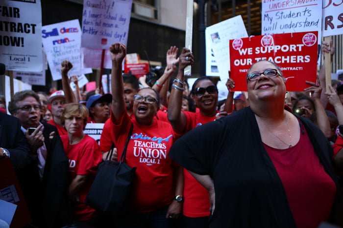 Chicago Teachers Union President Karen Lewis (front right) stands with her teachers during the union’s last strike in 2012. Teachers and CPS appear to be closer to a deal this time. (E. Jason Wambsgans / Chicago Tribune / MCT)