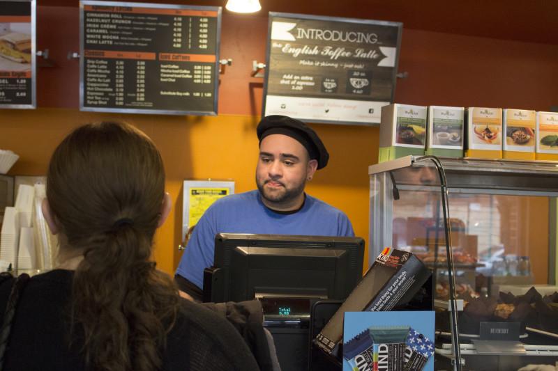 DePaul senior Tony Romero works at Brownstones at the Student Center in the Lincoln Park campus. Romero was housing insecure before securing housing through DePaul. (Megan Deppen / The DePaulia)