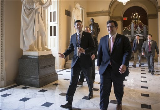 House Speaker Paul Ryan of Wis., center, walks to the House chamber on Capitol Hill in Washington, Friday, Feb. 12, 2016, as Republicans and Democrats joined together to overwhelmingly approve legislation that hits North Korea with more stringent sanctions for refusing to stop its nuclear weapons program.   (AP Photo/J. Scott Applewhite)