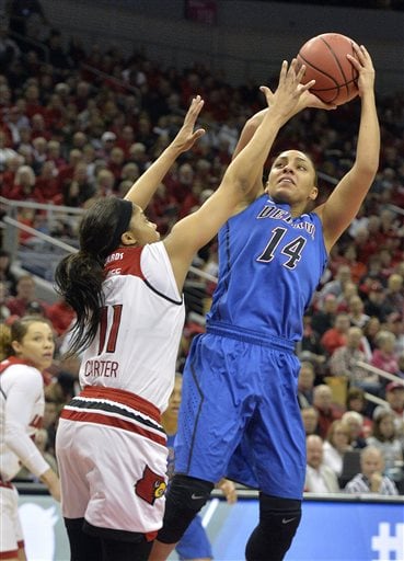 DePaul's Jessica January (14) shoots over Louisville's Arica Carter (11) during the first half of a second-round women's college basketball game in the NCAA Tournament in Louisville, Ky., Sunday, March 20, 2016. (AP Photo/Timothy D. Easley)