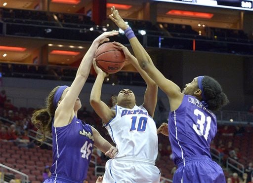 DePaul's Amarah Coleman (10) attempts a shot through the defense of James Madison's Kayla Cooper-Williams (31) and Savannah Felgemacher (45) during the second half of a first-round women's college basketball game in the NCAA Tournament in Louisville, Ky., Friday, March 18, 2016. DePaul won 97-67. (AP Photo/Timothy D. Easley)