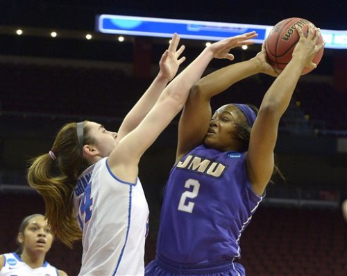 James Madison's Destiny Jones (2) attempts a shot over the defense of DePaul's Jacqui Grant (34) during the first half of a first-round women's college basketball game in the NCAA Tournament in Louisville, Ky., Friday, March 18, 2016. (AP Photo/Timothy D. Easley)