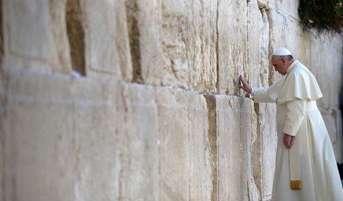 When Pope Francis visited Israel in 2014, one of his stops was at the Western Wall. This photo is part of an exhibition titled "Building Bridges of Faith," which will be on display at Richardson Library this spring. (Photo courtesy of Israel’s Ministry of Foreign Affairs)​