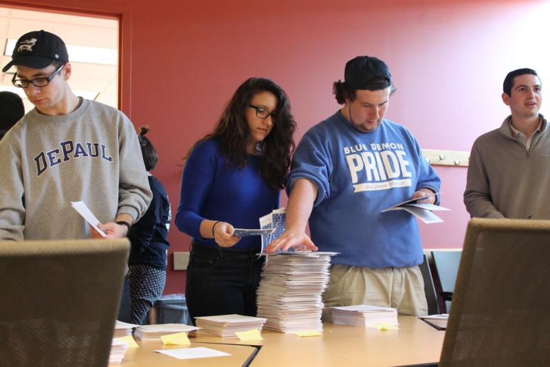 SGA members gather postcards to bring to Springfield. SGA and students will advocate for MAP April 20. (Maddy Crozier / The DePaulia)