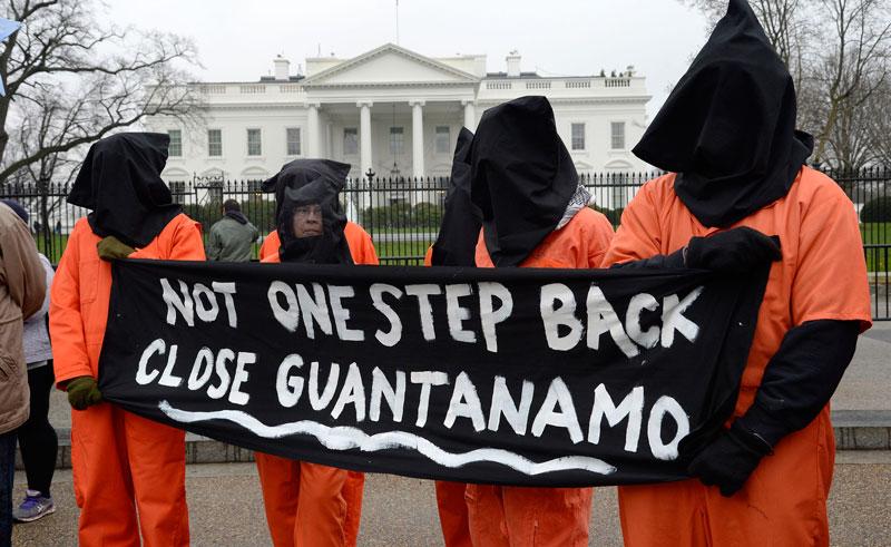 Activists protest Guantanamo Bay, the detainment camp in Cuba. President Obama announced plans to close the prison in February, but some are calling for an expedited process. (Olivier Douliery / MCT Campus)