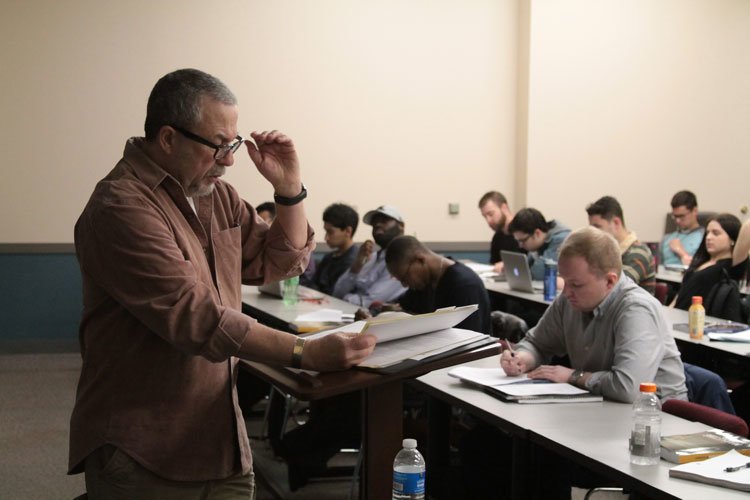 Adjunct professor Ilan Geva goes through the syllabus of his marketing class. Geva has been at DePaul for 10 years and is one of 1,800 adjunct faculty that teach per year, on average. (Megan Deppen / The DePaulia)