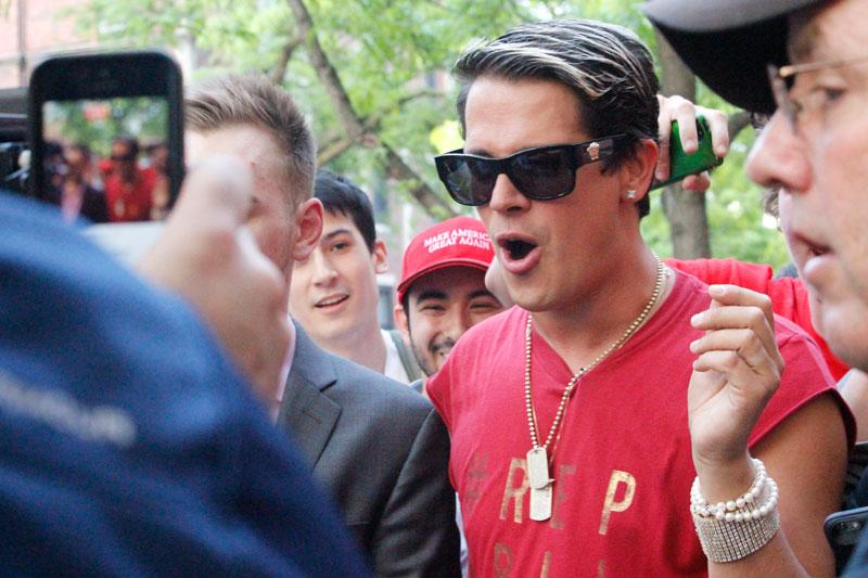 Milo Yiannopoulos walks through campus after his event was disrupted by protesters. (Kirsten Onsgard / The DePaulia)