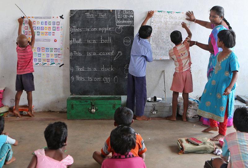 Young children work on their letters and numbers in a morning class at Dr. Subbarao Polineni's school in Martur, India. India has a high rate of malnourished children and Food for Education aims to get children back into schools. (J.B. Forbes | MCT Campus)