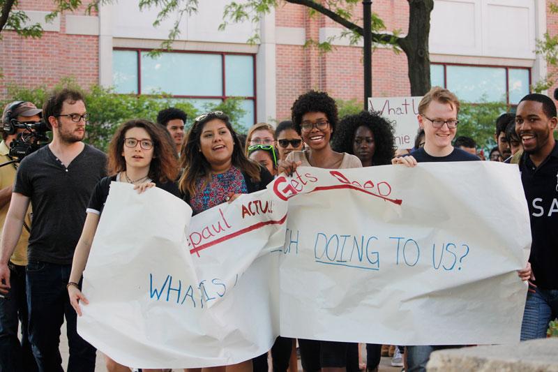 Protesters march from the Quad to the Student Center, where Yiannopoulos was speaking. (Kirsten Onsgard / The DePaulia)