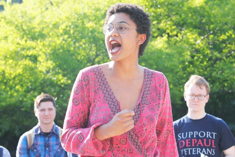 Anais Donald speaks to students gathered in the Quad. (Kirsten Onsgard / The DePaulia)