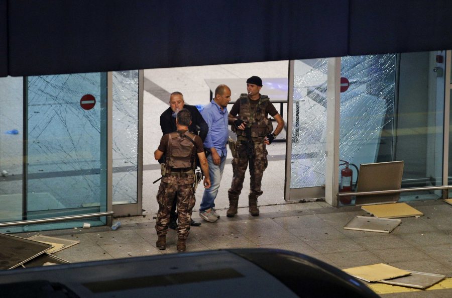 Turkish police officers stand outside Istanbul's Ataturk airport, late Tuesday, June 28, 2016. Two explosions have rocked Istanbul's Ataturk airport, killing several people and wounding others, Turkey's justice minister and another official said Tuesday. A Turkish official says two attackers have blown themselves up at the airport after police fired at them. Turkish authorities have banned distribution of images relating to the Ataturk airport attack within Turkey. (AP Photo/Emrah Gurel) TURKEY OUT