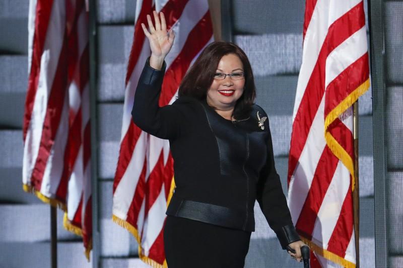 Rep. Tammy Duckworth, D-Ill., waves to delegates during the final day of the Democratic National Convention in Philadelphia , Thursday, July 28, 2016. (AP Photo/J. Scott Applewhite)