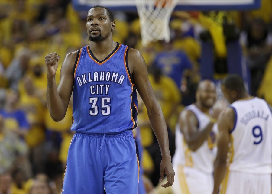 FILE - In a Monday, May 30, 2016 file photo, Oklahoma City Thunder forward Kevin Durant (35) reacts during the second half of Game 7 of the NBA basketball Western Conference finals against the Golden State Warriors in Oakland, Calif. Durant announced Monday, July 4, 2016, that he is joining All-Stars Stephen Curry and Klay Thompson with the Golden State Warriors.  Durant made the decision public on The Players’ Tribune Monday morning. He can’t officially sign until July 7.  (AP Photo/Marcio Jose Sanchez, File)