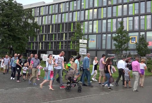 People leave a mall in Munich after a shooting Friday,  July 22, 2016. A manhunt is underway for the shooter or shooters who opened fire at the shopping mall, killing and wounding several people, a Munich police spokeswoman said. The city transit system shut down and police asked people to avoid public places. (Nonstop News | AP)