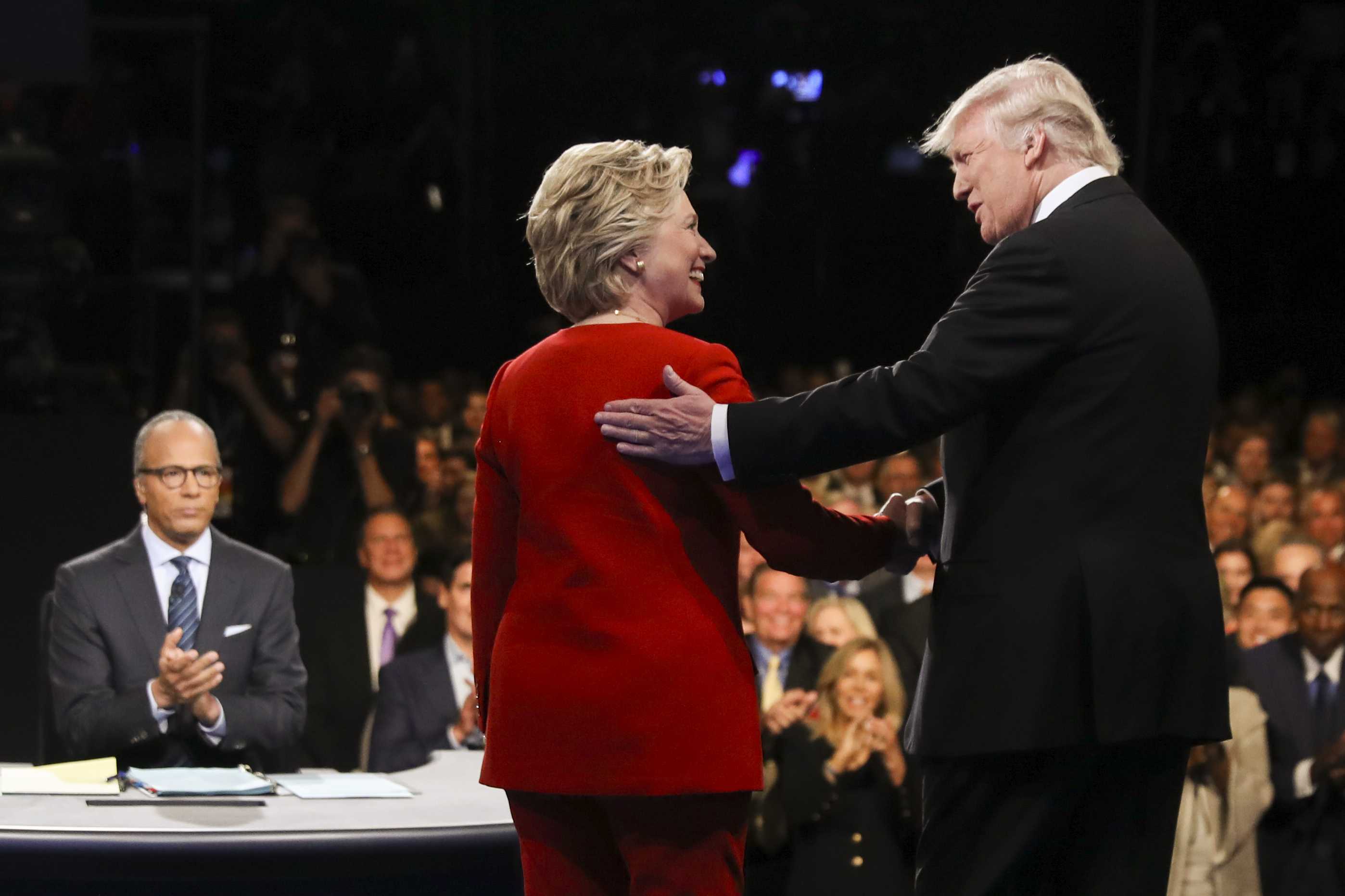 Democratic presidential nominee Hillary Clinton and Republican presidential nominee Donald Trump shake hands during the presidential debate at Hofstra University in Hempstead, N.Y., Monday, Sept. 26, 2016. (Joe Raedle/Pool via AP)