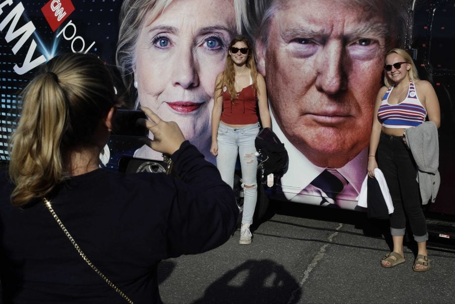 Students pose for photographs near the presidential debate between Democratic presidential candidate Hillary Clinton and Republican presidential candidate Donald Trump at Hofstra University Monday, Sept. 26, 2016, in Hempstead, N.Y. (AP Photo/Frank Franklin II)