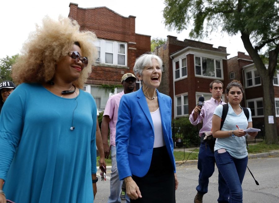 Green Party presidential candidate Jill Stein, center, walks on South Austin neighborhood with community activist Zerlina Smith in Chicago. (Tae-Gyun Kim/AP)

