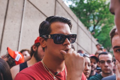 Milo Yiannopoulos stands in the Quad after his speech was shut down due to student protests. (Photo by Josh Leff / The DePaulia)