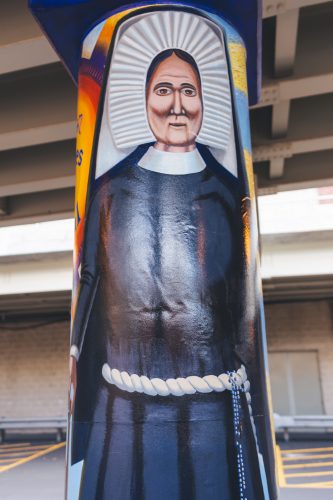 Murals painted underneath the Fullerton “L” station depict basketball coach Ray Meyer, Olympic athlete Dolly Staton and DePaul alum and civil rights activist Benjamin Hooks. (Photo by Josh Leff / The DePaulia) 