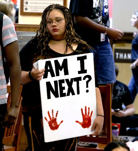Protesters fill the food court chanting "Black Lives Matter" in the Oklahoma Memorial Union at the University of Oklahoma on Thursday, Sept. 22, 2016 in Norman, Okla. Prosecutors in Tulsa, Oklahoma, charged a white police officer who fatally shot an unarmed black man on a city street with first-degree manslaughter Thursday. (Steve Sisney/The Oklahoman via AP)