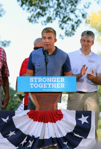 President of DePaul College Democrats Jack McNeil speaks at a Quad Cities rally. Democratic presidential nominee Hillary Clinton spoke a few hours later at the same event. (Photo courtesy of Chris Beiderbecke)