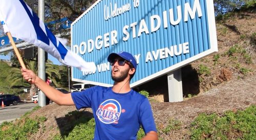 DePaul senior Josue Ortiz "Flies the W" outside of Dodger Stadium in Los Angeles. (Photo courtesy of Josue Ortiz)