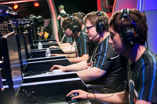 Team Fusion's Zach Malhas "Nien," second from right, leads his fellow teammates as they compete with Team Dignitas during a broadcasted League of Legends tournament event to enter the North American LCS league, at Riot Games studio on April 26, 2015 in Los Angeles. (Marcus Yam/Los Angeles Times/TNS)