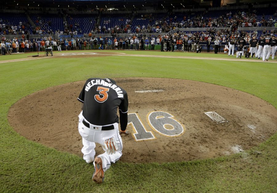 Miami Marlins' Adeiny Hechavarria (3) touches the pitcher's mound with the number 16 in honor of Marlins pitcher Jose Fernandez, after a baseball game against the New York Mets, Wednesday, Sept. 28, 2016, in Miami. Fernandez was killed in a boating accident in Miami Sunday. The Mets defeated the Marlins 5-2. (AP Photo/Lynne Sladky)