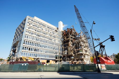 Developers estimate demolition will be finished by November, clearing space for a massive redevelopment project. The complex will hold apartment buildings with 540 units, up to 60 condominiums and about 160,000 square feet of retail space. (Garrett Duncan/The DePaulia)