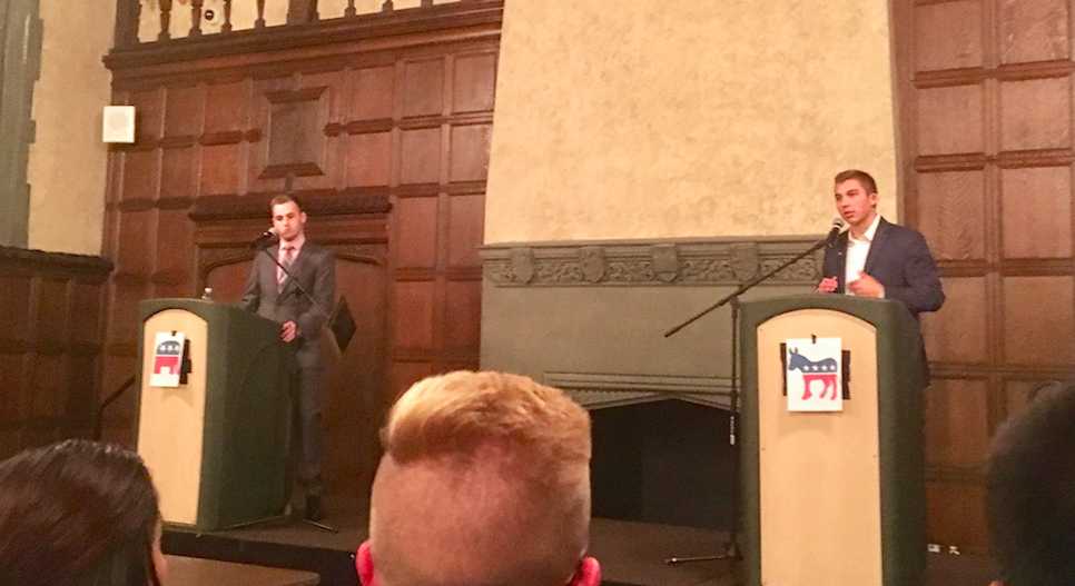 DePaul students John Minster and Jack McNeil debate Monday night. (Courtesy of Evan Keller)