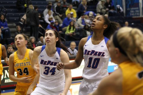 Senior forward Jacqui Grant (left) and junior guard Amarah Coleman (right) wait for a rebound. (Caroline Stacey / The DePaulia)