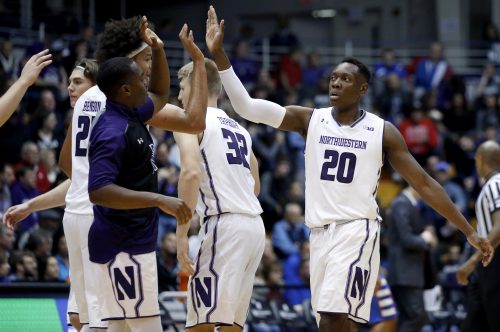 Northwestern guard/forward Scottie Lindsey (20) celebrates with teammates after scoring a basket against DePaul during the first half of an NCAA college basketball game Saturday, Dec. 3, 2016, in Evanston, Ill. (AP Photo/Nam Y. Huh)