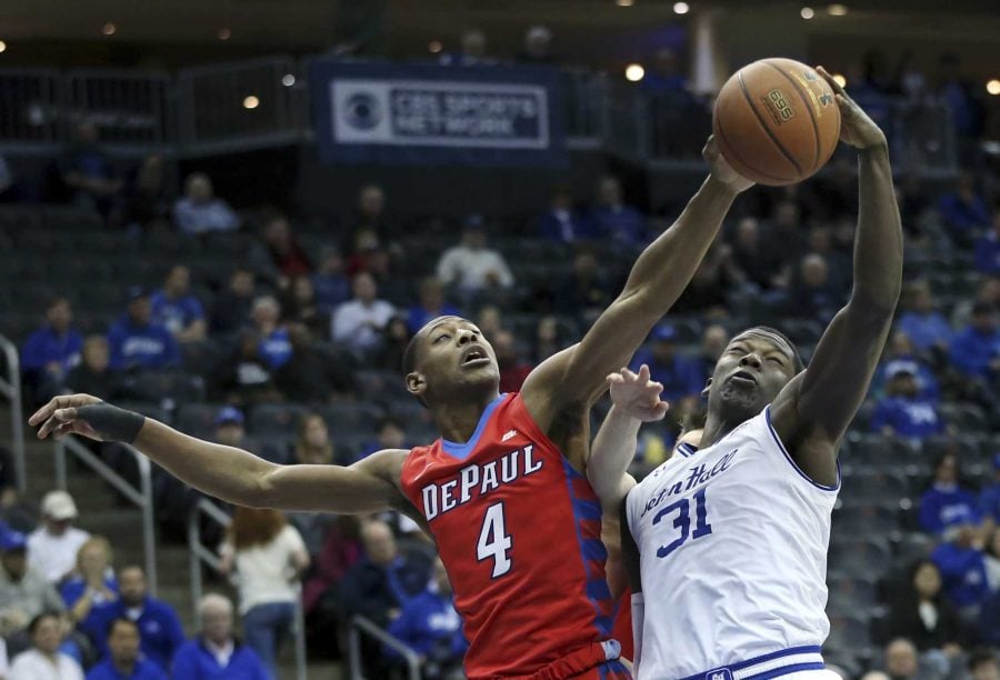 DePaul guard Brandon Cyrus (4) vies for the ball with Seton Hall forward Angel Delgado (31) during the first half of an NCAA college basketball game Saturday, Jan. 7, 2017, in Newark, N.J. AP Photo/Mel Evans)