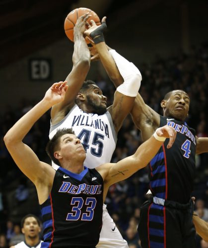 DePaul guard Brandon Cyrus (4) tries to block a shot by Villanova forward Darryl Reynolds (45) as DePaul forward Joe Hanel (33) looks up during the first half of an NCAA college basketball game, Wednesday, Dec. 28, 2016, in Villanova, Pa. (AP Photo/Laurence Kesterson)