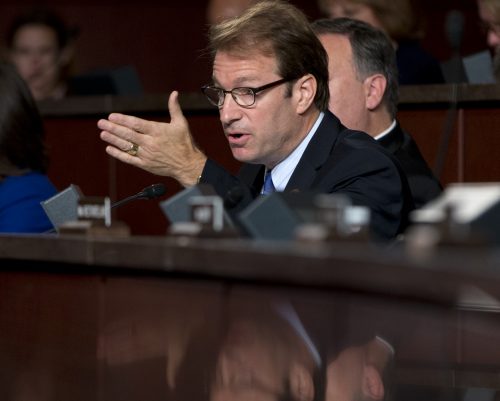 FILE - In this Sept. 17, 2014 file photo, Rep. Peter Roskam, R-Ill., speaks on Capitol Hill in Washington. About 18,000 callers participated in a telephone town hall Monday, Feb. 13, 2017, hosted by Roskam, a suburban Chicago Republican whose been criticized for canceling smaller in-person meetings and declining debates. (AP Photo/Carolyn Kaster, File)