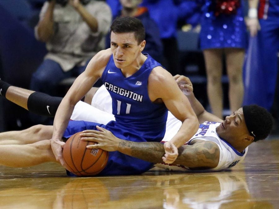 Creighton guard Tyler Clement, left, and DePaul guard Devin Gage battle for a loose ball during the first half of an NCAA college basketball game Saturday, Feb. 11, 2017, in Rosemont, Ill. (AP Photo/Nam Y. Huh)