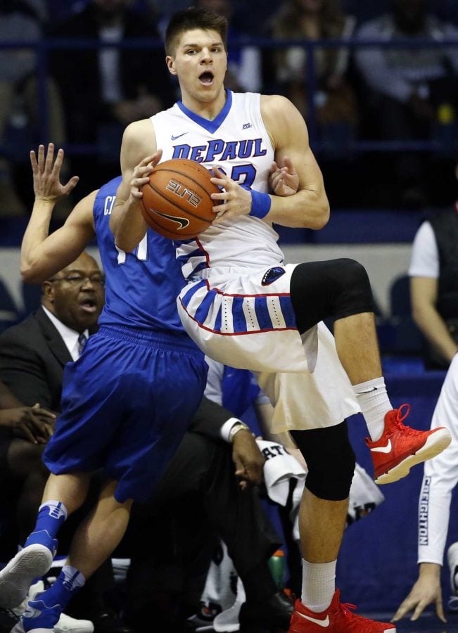 DePaul forward Joe Hanel, right, looks to pass against Creighton guard Tyler Clement during the first half of an NCAA college basketball game Saturday, Feb. 11, 2017, in Rosemont, Ill. (AP Photo/Nam Y. Huh)