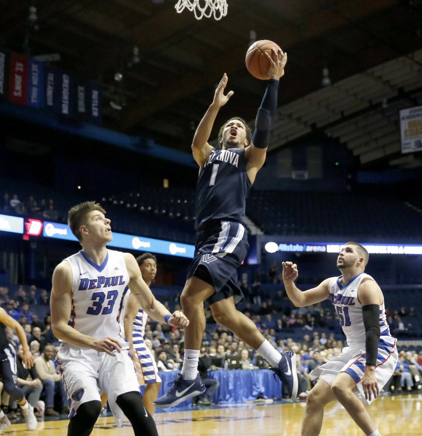 Villanova 's Jalen Brunson (1) drives and scores past DePaul 's Joe Hanel (33) and Chris Harrison-Docks (51) during the second half of an NCAA college basketball game Monday, Feb. 13, 2017, in Rosemont, Ill. Villanova won 75-62. (AP Photo/Charles Rex Arbogast)