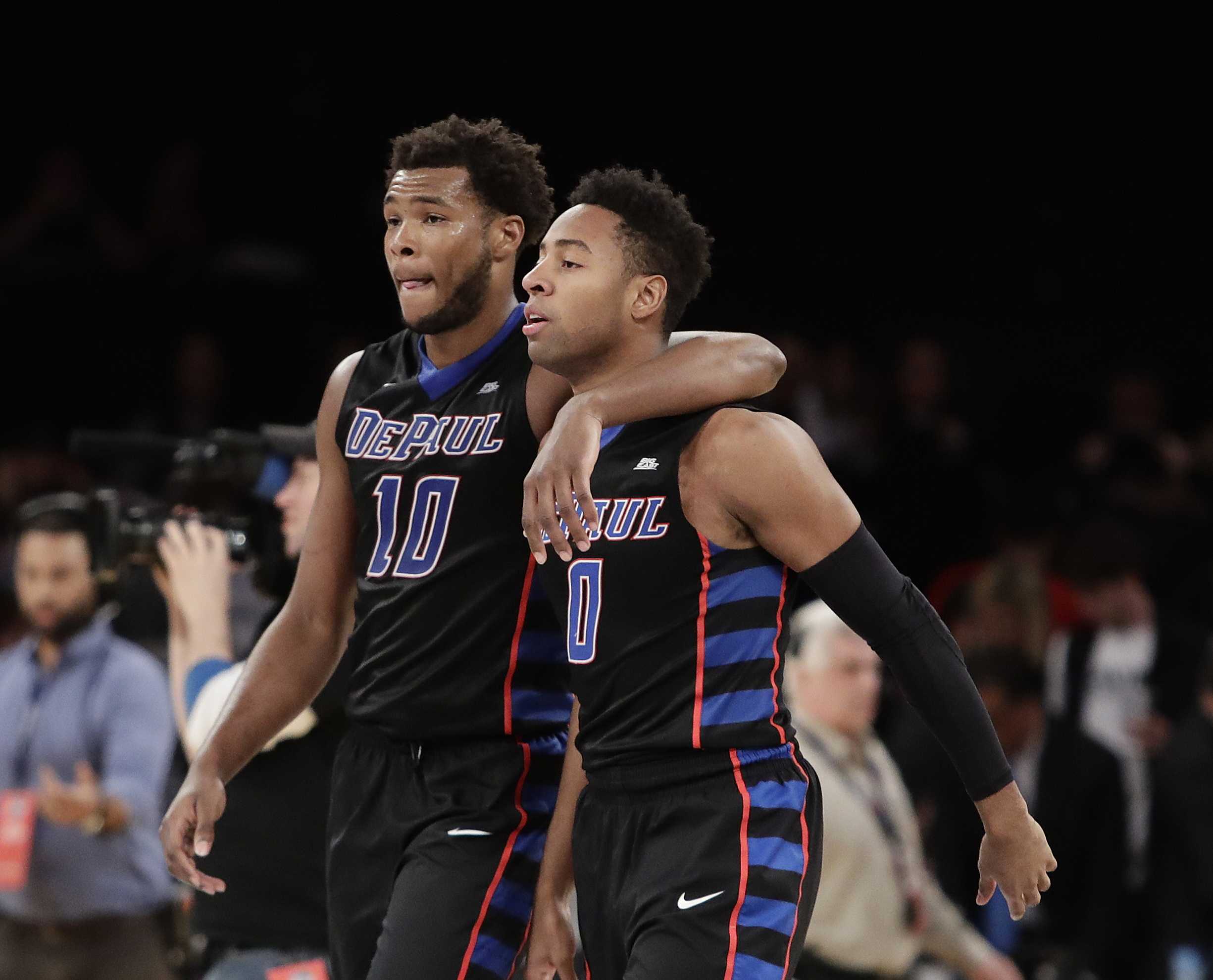 DePaul's Tre'Darius McCallum (10) and R.J. Curington (0) leave the court after the team's NCAA college basketball game against Xavier during the Big East men's tournament Wednesday, March 8, 2017, in New York. Xavier won 75-64. (AP Photo/Frank Franklin II)